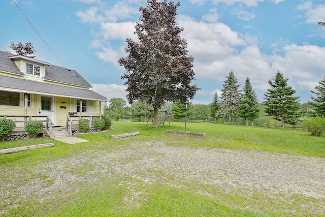 view of yard with covered porch