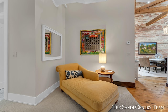 sitting room with hardwood / wood-style flooring