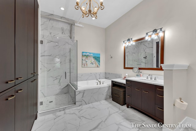 bathroom with shower with separate bathtub, vanity, and an inviting chandelier