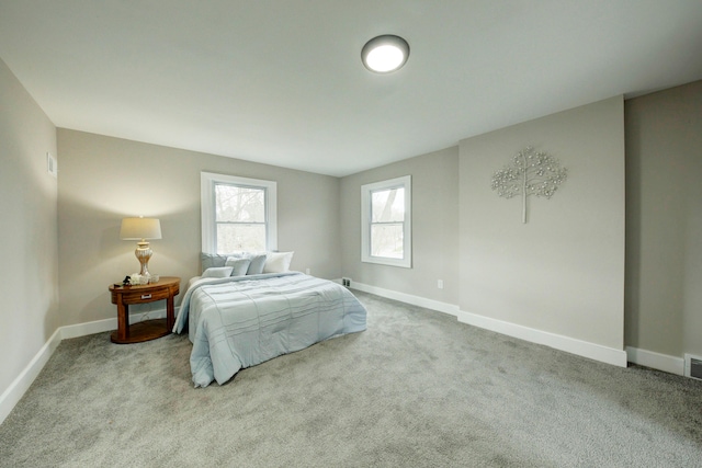 bedroom with light carpet