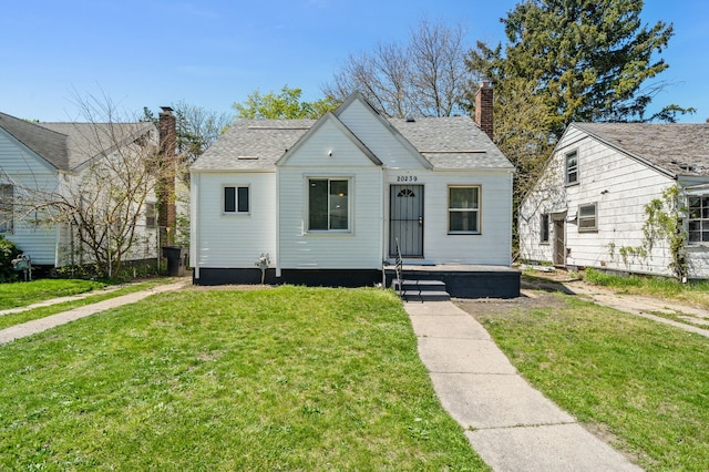 bungalow with a front lawn