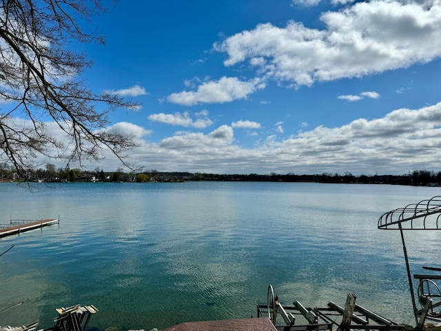 property view of water with a dock