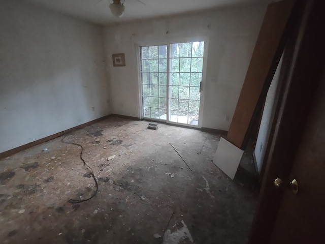 unfurnished room with ceiling fan