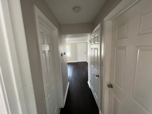 hallway featuring dark hardwood / wood-style flooring