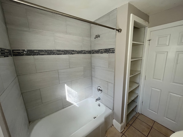 bathroom featuring tile patterned flooring and tiled shower / bath combo