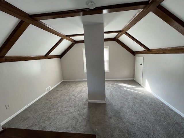 bonus room with carpet floors and vaulted ceiling