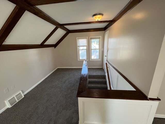 stairs featuring carpet flooring and lofted ceiling