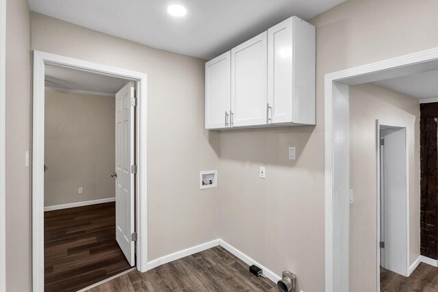 clothes washing area featuring washer hookup and dark wood-type flooring