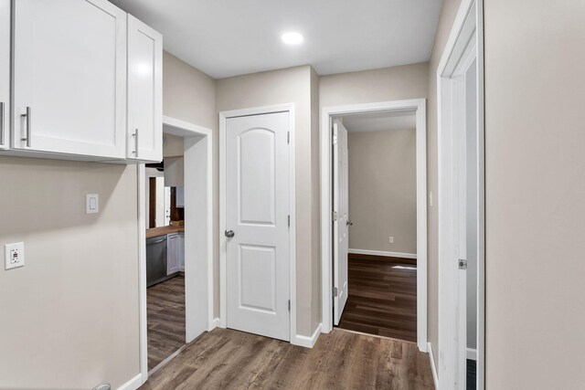 hallway with dark wood-type flooring