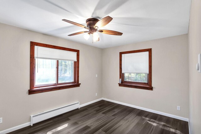 spare room with ceiling fan, dark hardwood / wood-style flooring, and a baseboard radiator