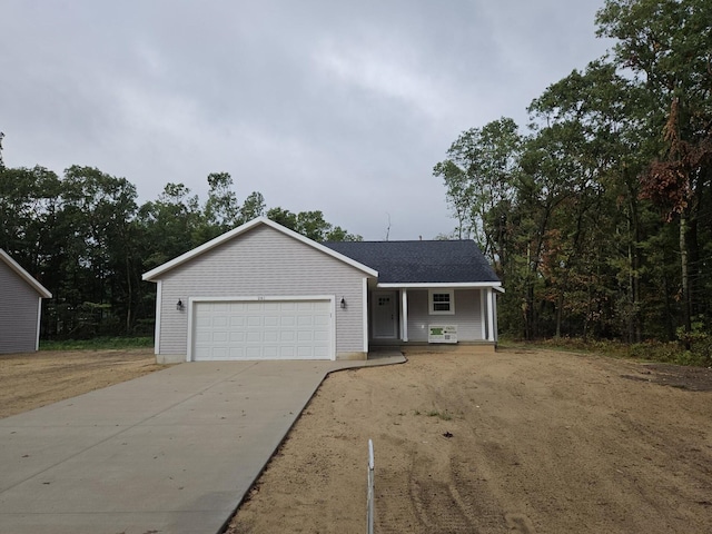 view of front facade with a porch and a garage