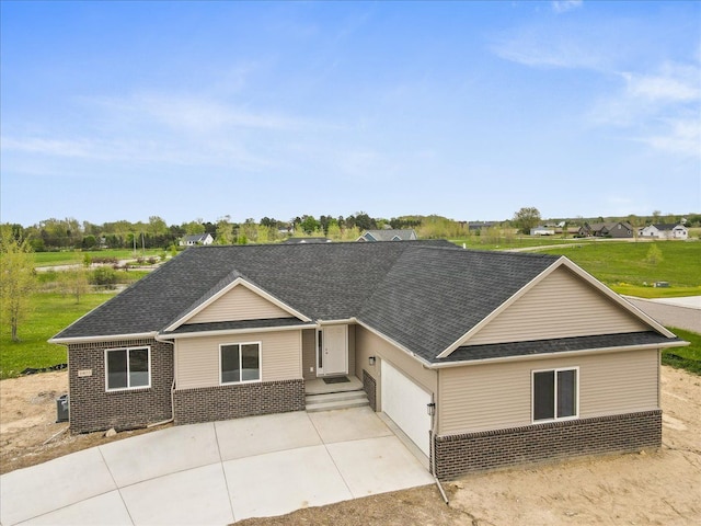 ranch-style house featuring a garage