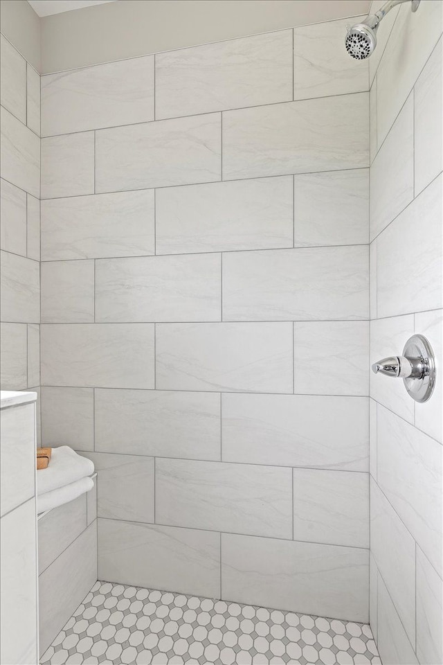 bathroom with a tile shower