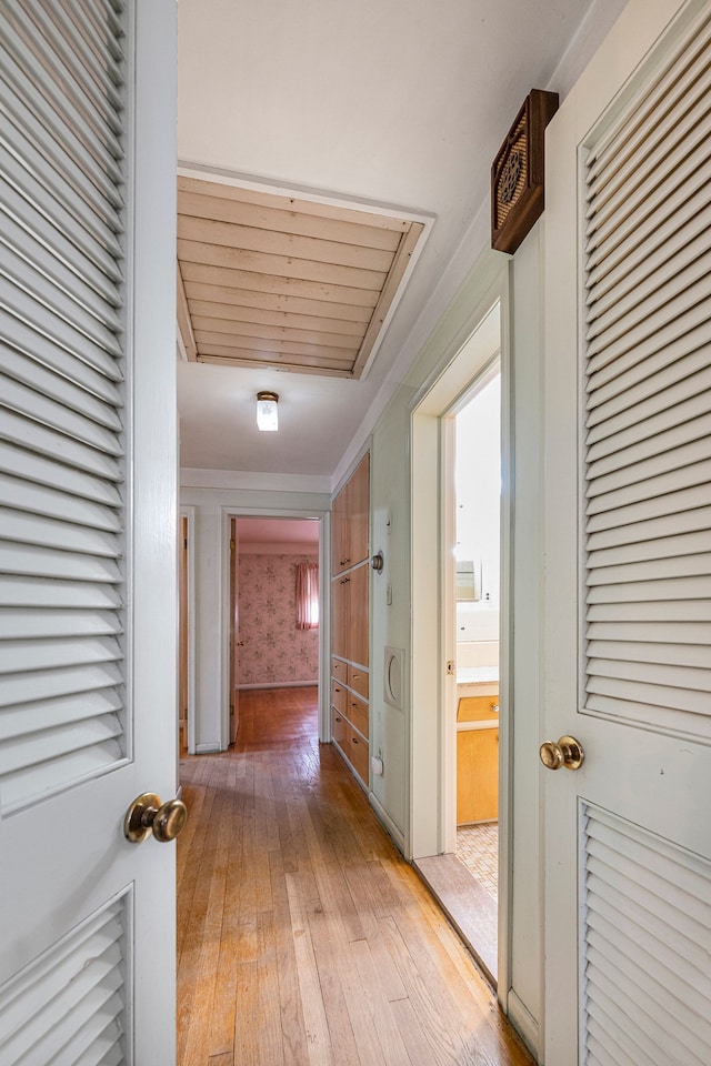 hallway with light wood-type flooring