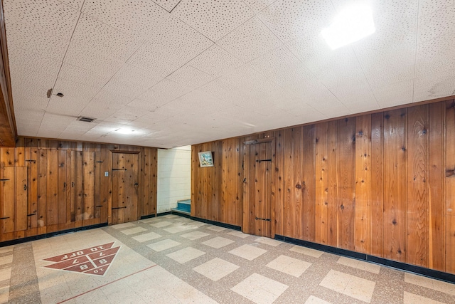 basement with wood walls