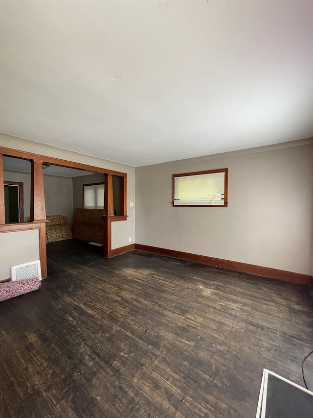 2734 Cumings Ave, Flint, MI 48503 - empty room with dark wood-type flooring and baseboards