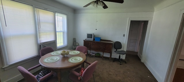 carpeted dining area featuring ceiling fan