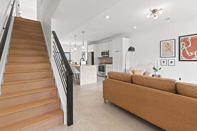 living room featuring an inviting chandelier