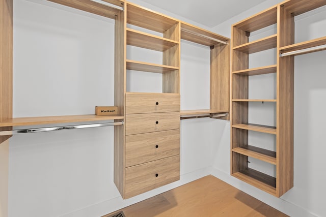 spacious closet featuring light wood-type flooring