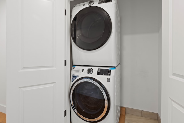 laundry area featuring stacked washer and dryer