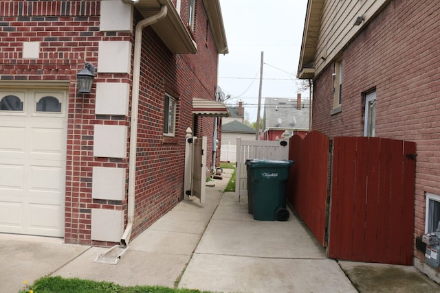 view of side of home featuring a garage