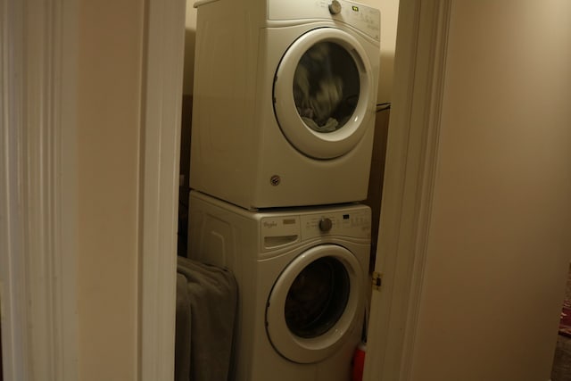 washroom with stacked washer / drying machine