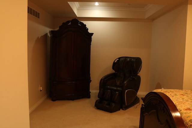 bedroom with a tray ceiling, carpet, and ornamental molding