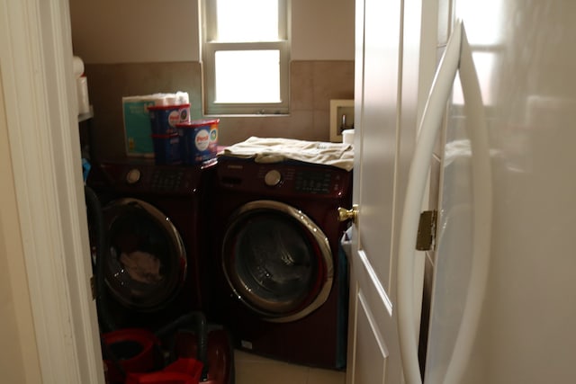 laundry area featuring washing machine and clothes dryer