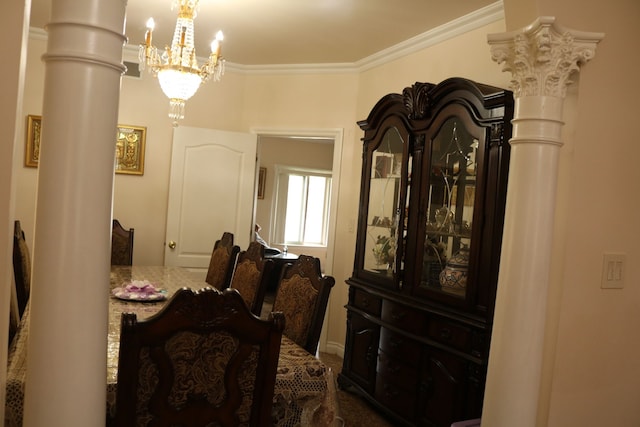 dining area with a notable chandelier, crown molding, and decorative columns