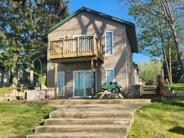 rear view of house with a balcony