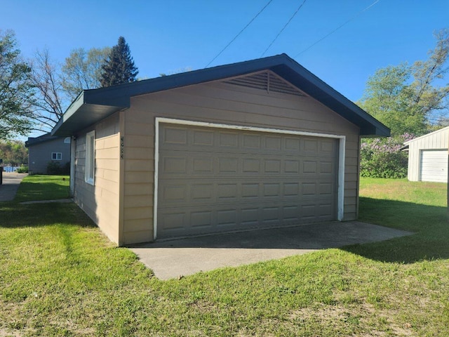 garage featuring a lawn