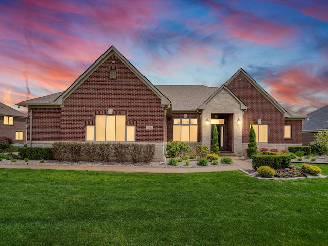 view of front of property with a lawn