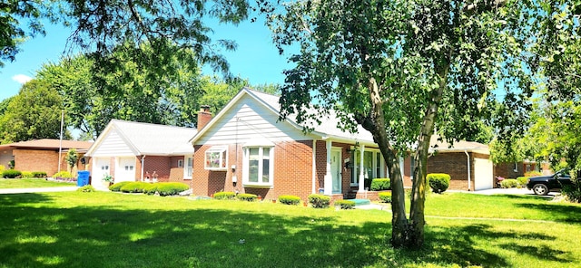 view of front facade with covered porch, a garage, and a front yard