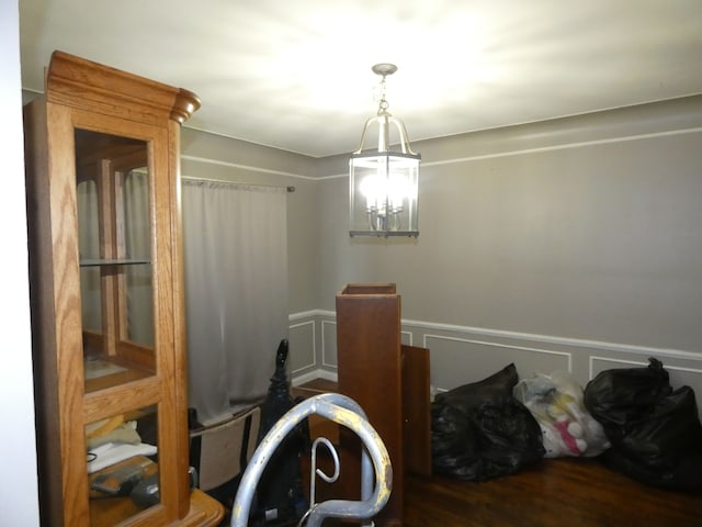 interior space featuring a chandelier and wood-type flooring