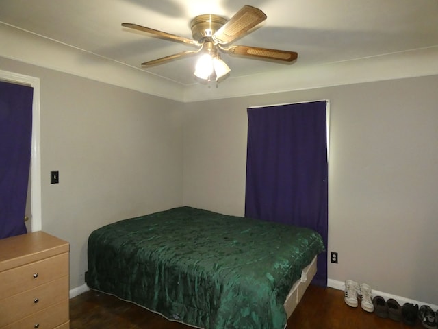 bedroom featuring dark hardwood / wood-style floors and ceiling fan