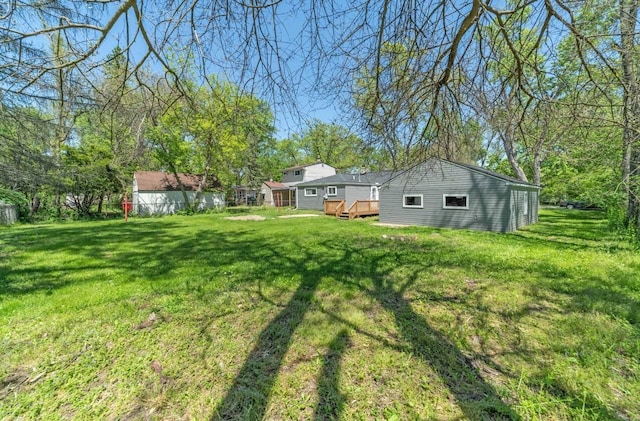 view of yard with a wooden deck