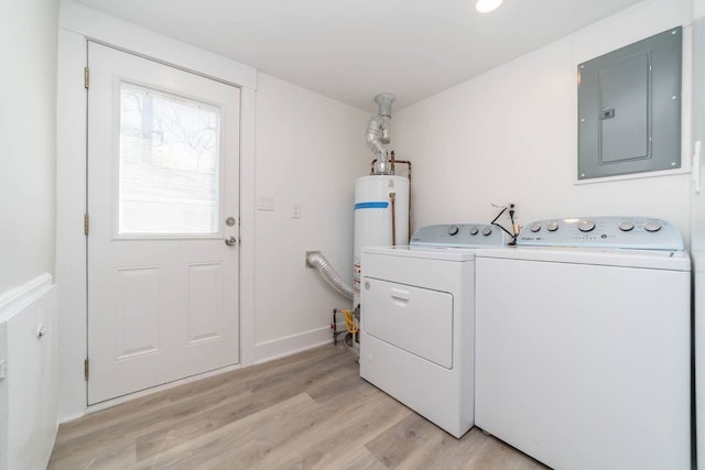 laundry area with laundry area, electric panel, water heater, light wood-style floors, and washing machine and dryer