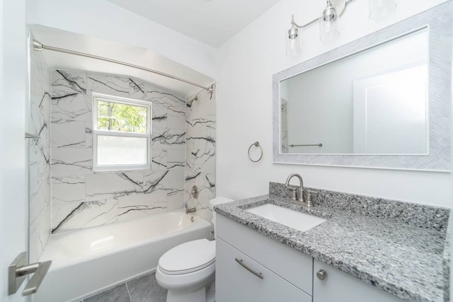 full bathroom featuring tile patterned flooring, vanity, toilet, and tiled shower / bath