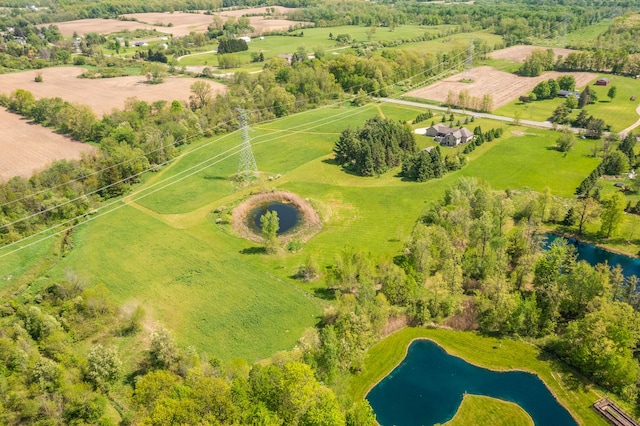 bird's eye view featuring a rural view and a water view