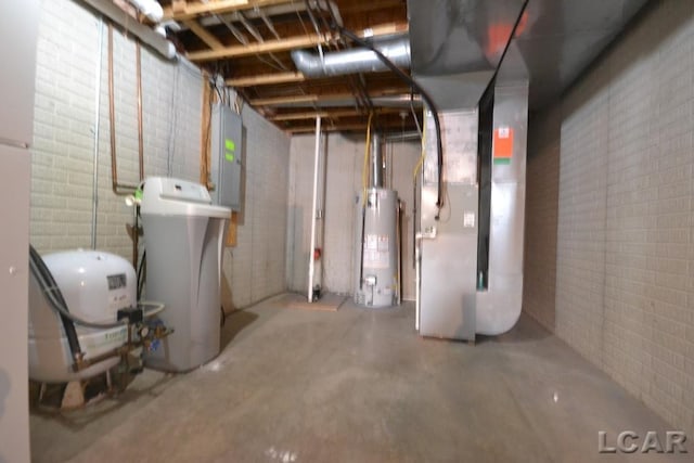 basement featuring gas water heater and electric panel