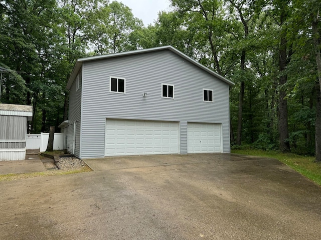 view of side of property featuring a garage