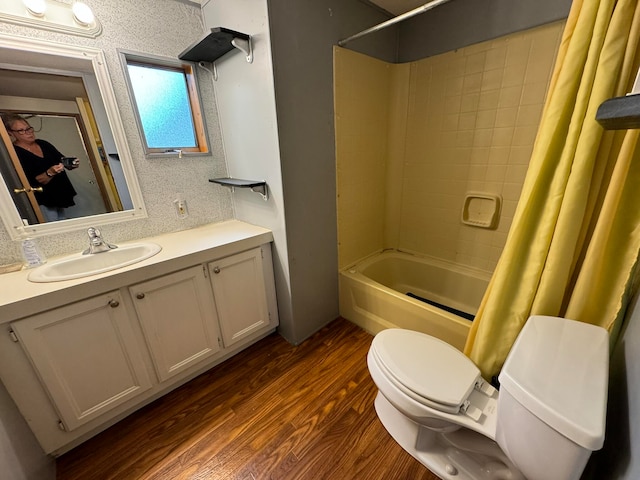 full bathroom with shower / bath combination with curtain, vanity, wood-type flooring, and toilet