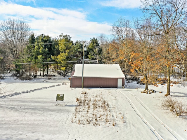 view of front facade with an outbuilding and a garage