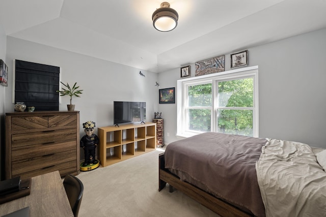 carpeted bedroom featuring vaulted ceiling