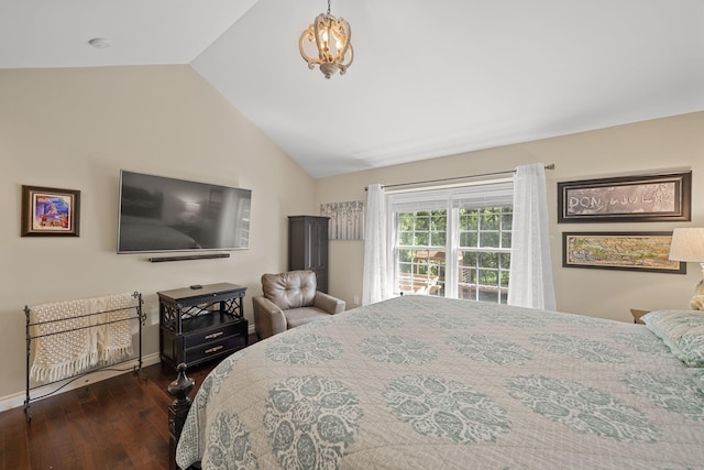 bedroom featuring dark hardwood / wood-style flooring, an inviting chandelier, and vaulted ceiling