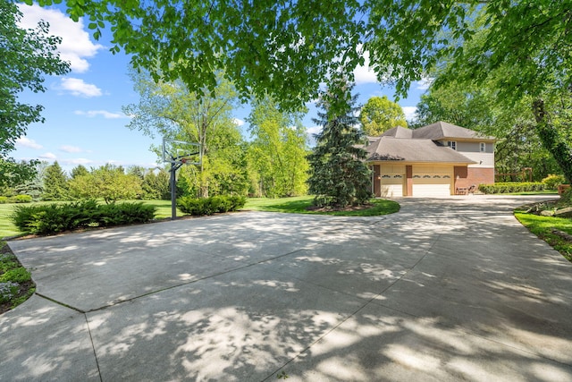 exterior space featuring a front yard and a garage