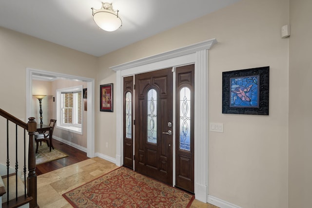 entryway with hardwood / wood-style floors