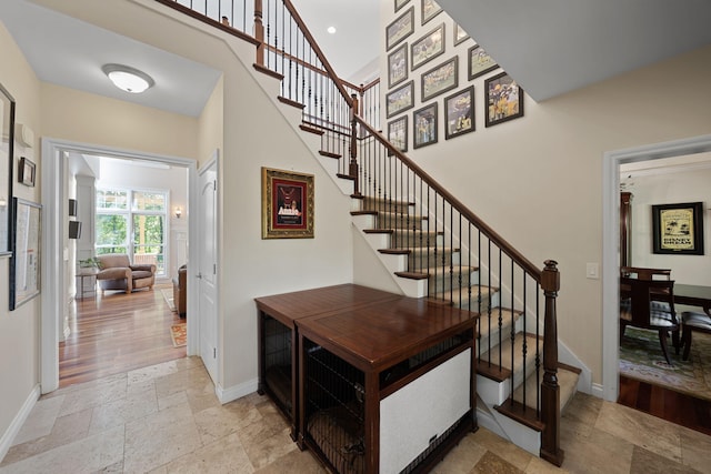 stairway with hardwood / wood-style floors