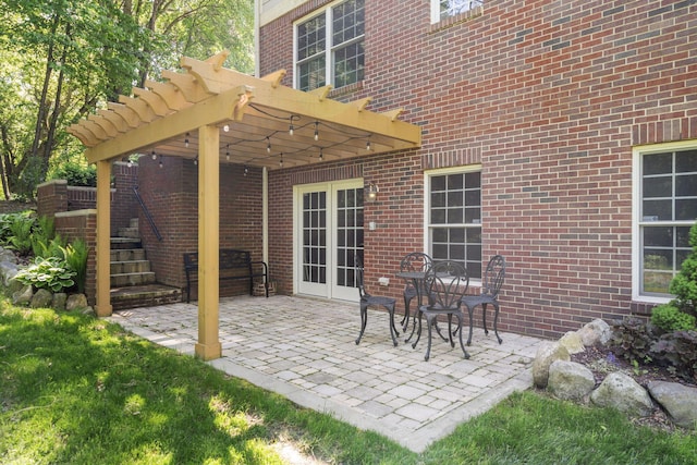 view of patio / terrace with french doors and a pergola