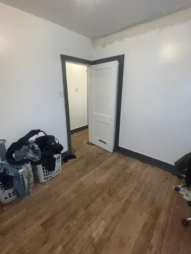 spare room with hardwood / wood-style flooring